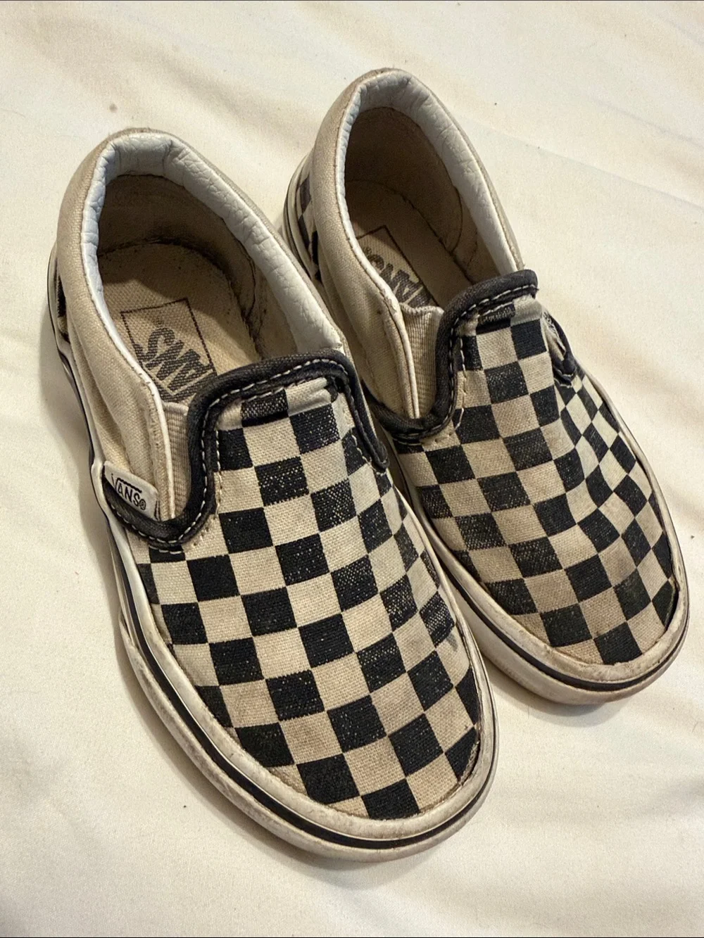 Vans Kids Checkerboard Slip-On Sneakers in Black and White
